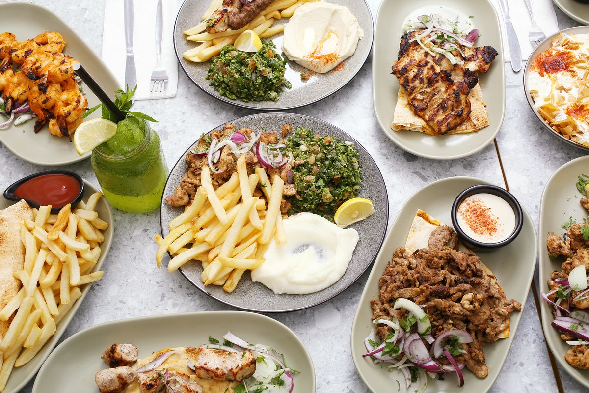 Shawarma plates with chips, grilled chicken, prawn skewers and a lemon and mint juice